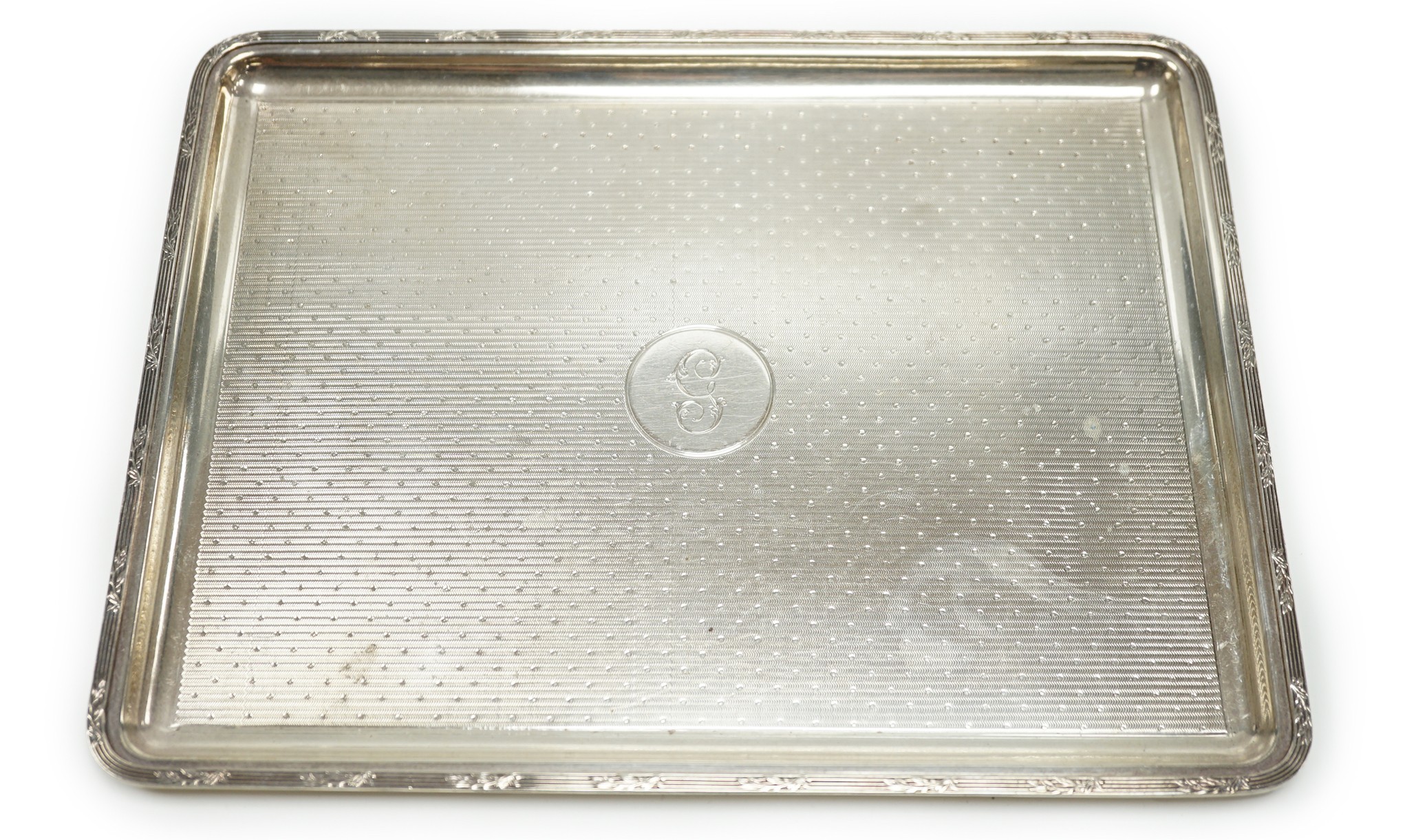 A George V engine turned silver dressing table tray, by Mappin & Webb, London 1915, 27.5cm, 15.3oz.